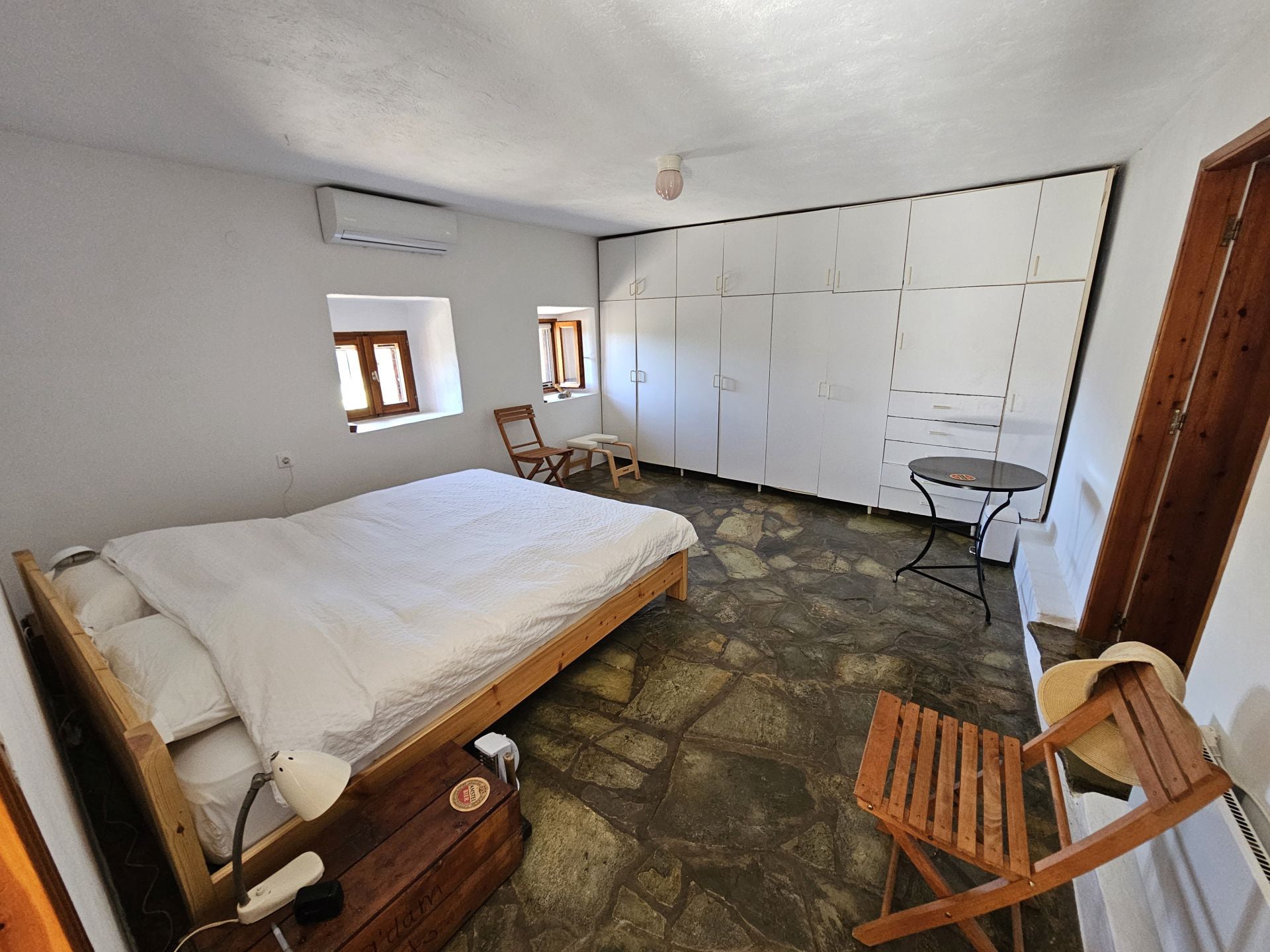 One of the two bedrooms on the ground floor of the renovated house