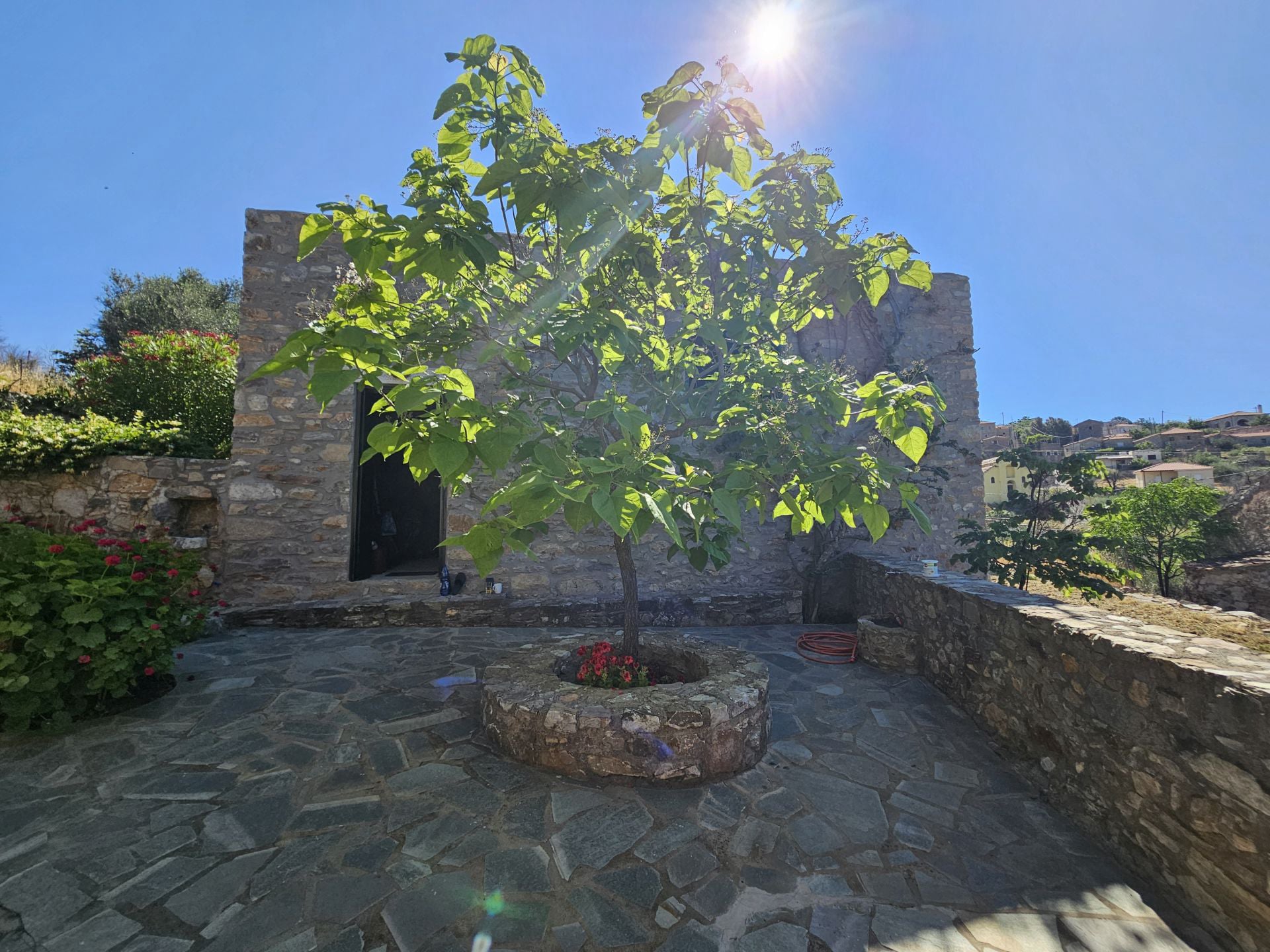 The semi-renovated house an the patio
