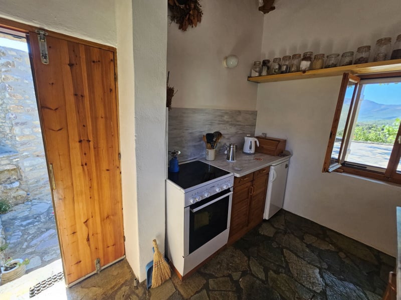 The entrace door to the upper level of the renovated house through the kitchen